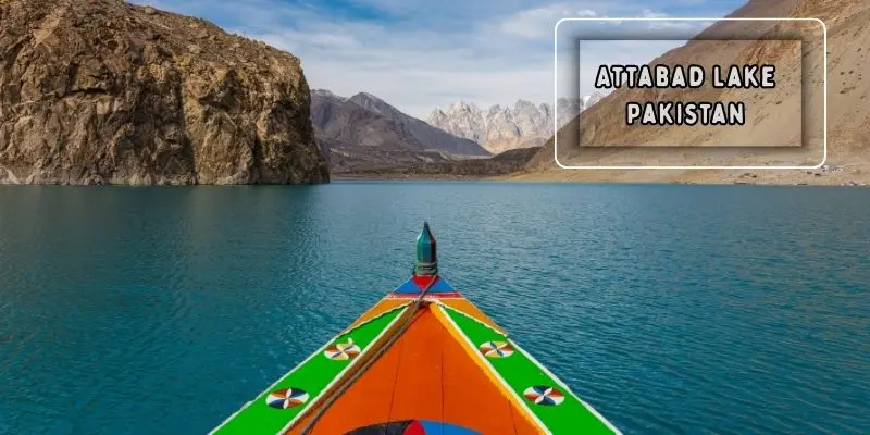 Attabad lake with boats and rugged mountain backdrop