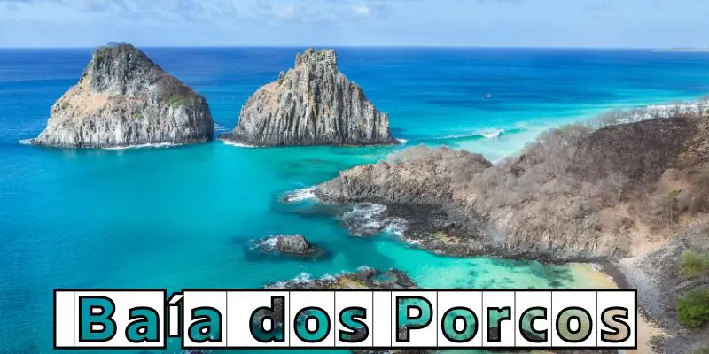 Baía dos porcos beach in brazil with turquoise water and rocky cliffs