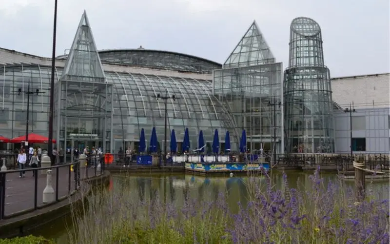 Bluewater kent shopping mall lakeside exterior view with landscaped surroundings