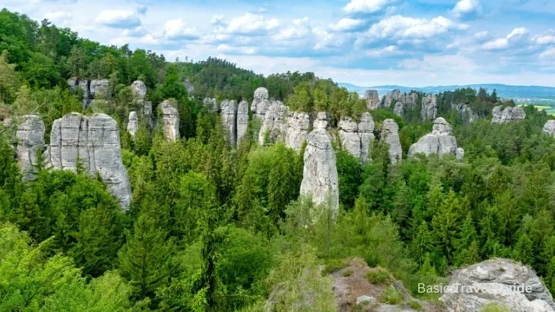 Scenic view of bohemian paradise featuring dramatic rock towers and greenery
