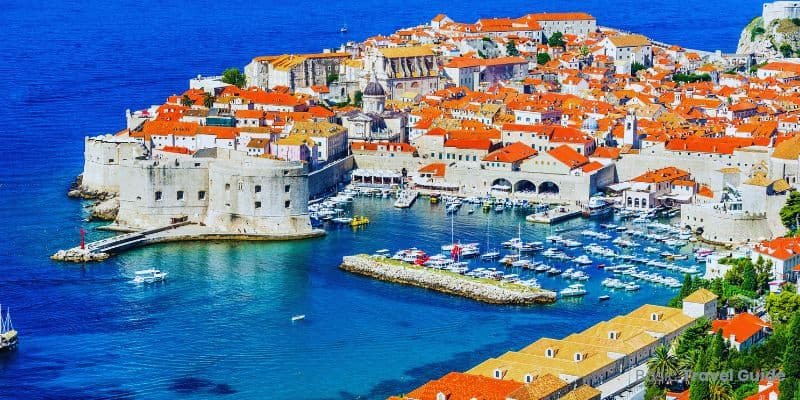 Colorful houses along the coastline in croatia with clear blue sea