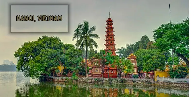 Hoan kiem lake with turtle tower in the heart of hanoi, vietnam
