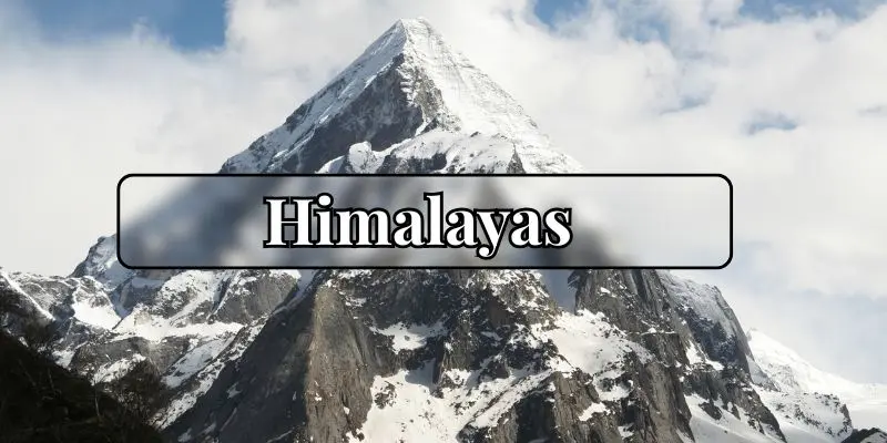 Snow-covered peaks of the himalayas under a clear blue sky