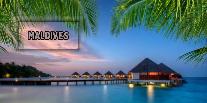 Overwater bungalows on clear blue waters in the maldives