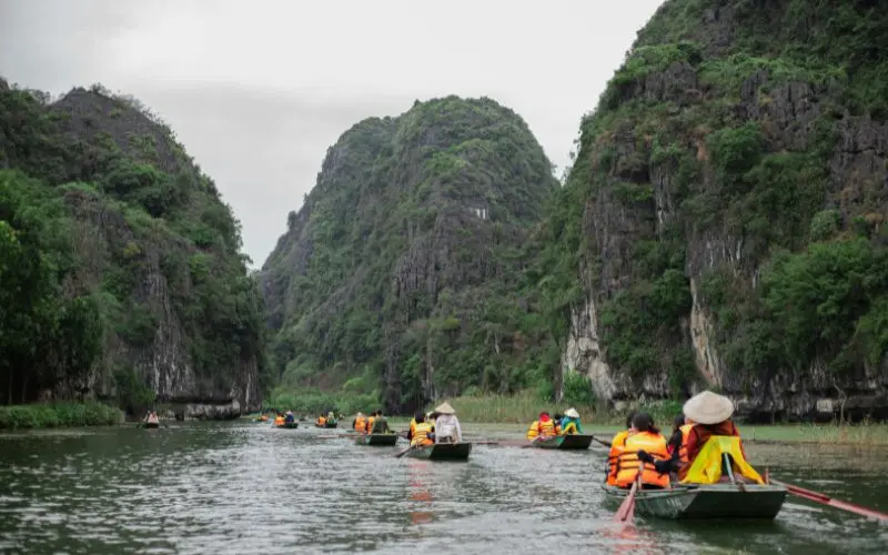 Ninh binh boat ride through limestone cliffs