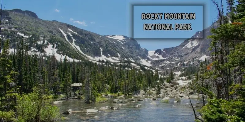 Crystal-clear alpine lake surrounded by mountains in rocky mountain national park