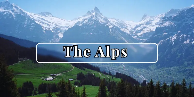 Snow-covered peaks of the alps under a bright blue sky