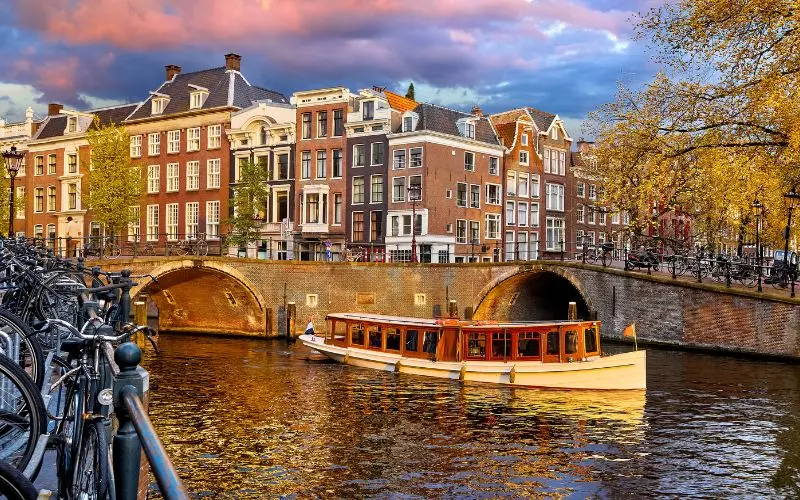 15 Most Beautiful Cities In The World You Should Visit Historic canal houses and bridge in amsterdam, netherlands