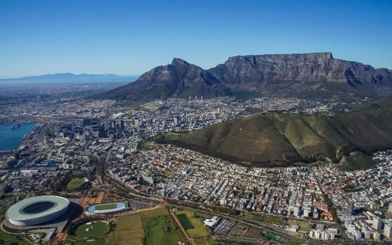 15 Most Beautiful Cities In The World You Should Visit Table mountain overlooking cape town, south africa