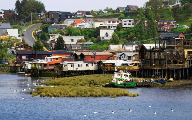 Colorful palafitos along the waterfront in chiloé island chile