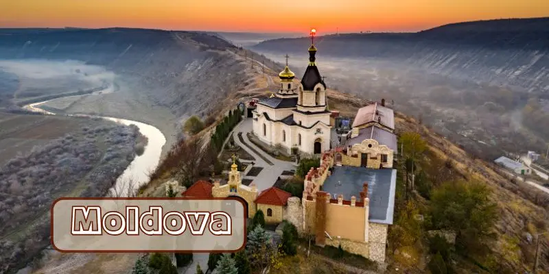Cliffside old orhei monastery overlooking raut river, moldova one of the cheapest european countries to visit in july