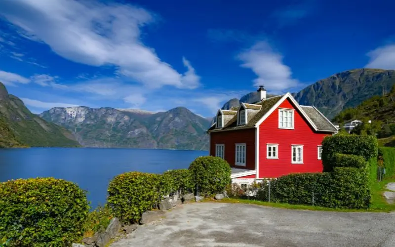 12 Best Countries To Visit In Europe: Top Picks For Your Next Vacation Norwegian fjord surrounded by mountains and dramatic natural scenery