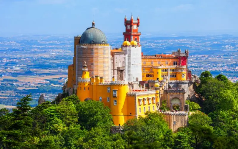 The Best Things To Do In Lisbon Portugal In One Trip Colorful pena palace overlooking the hills of sintra