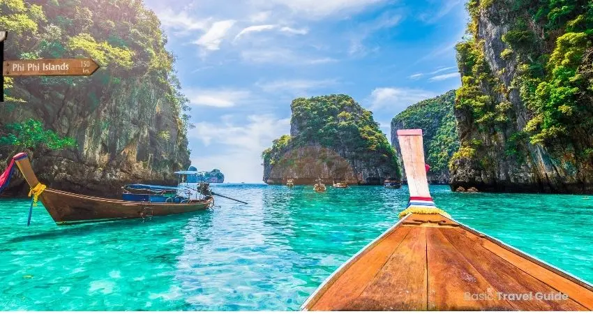 Scenic view of phi phi islands with boats and clear tropical sea