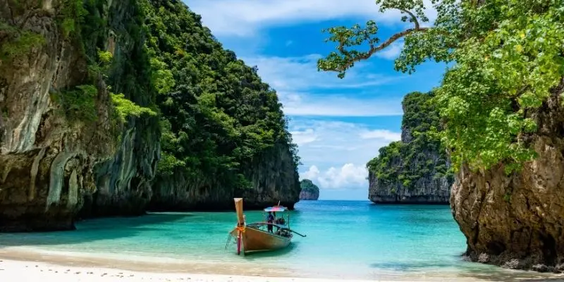 Thailand island hopping by long-tail boat between tropical islands