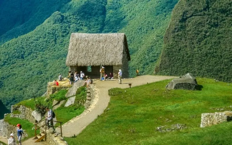 Ravelers exploring machu picchu with scenic mountain backdrop