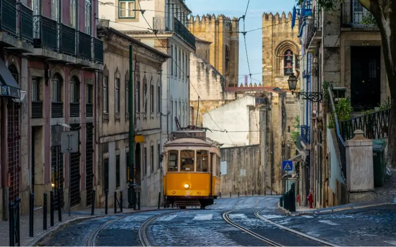 The Best Things To Do In Lisbon Portugal In One Trip Historic yellow tram 28 traveling through the streets of lisbon one of the best things to do in lisbon portugal