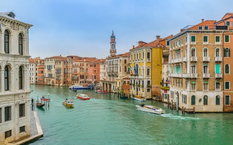 15 Most Beautiful Cities In The World You Should Visit Grand canal with gondolas and historic buildings in venice, italy